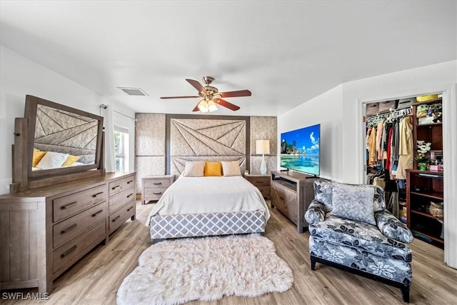 167 Pembroke St, Lehigh Acres, FL 33974 - bedroom featuring ceiling fan, visible vents, a spacious closet, and light wood finished floors