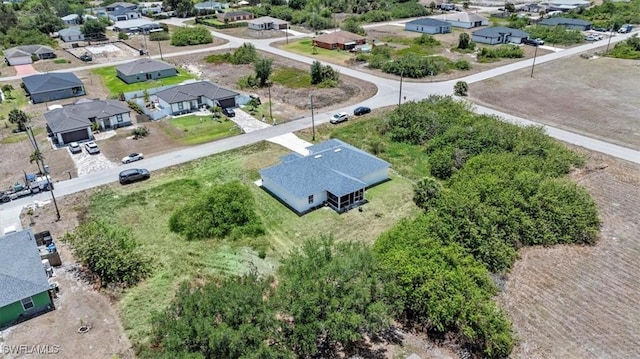 167 Pembroke St, Lehigh Acres, FL 33974 - bird's eye view with a residential view