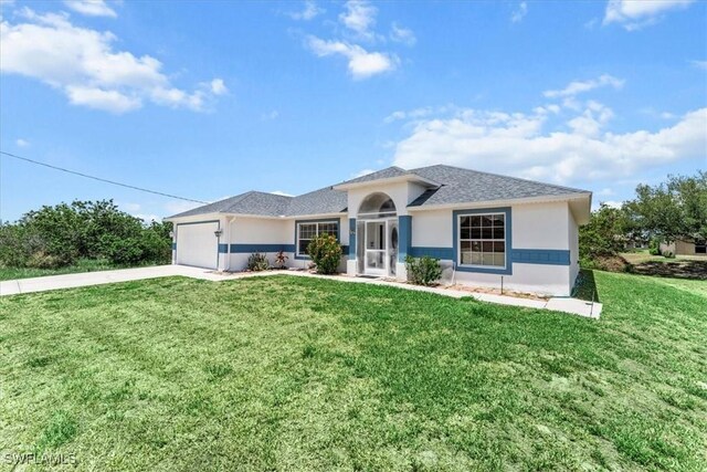 167 Pembroke St, Lehigh Acres, FL 33974 - view of front of property featuring an attached garage, stucco siding, driveway, and a front yard
