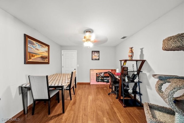 167 Pembroke St, Lehigh Acres, FL 33974 - dining space featuring baseboards, a ceiling fan, wood finished floors, and visible vents