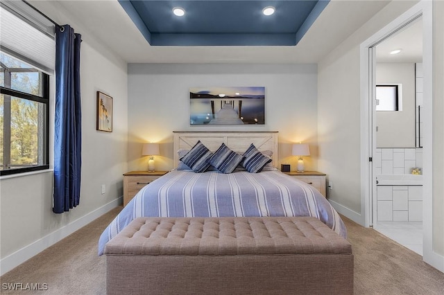 137 SE 23rd Ter, Cape Coral, FL 33990 - bedroom with a tray ceiling, carpet, baseboards, and recessed lighting