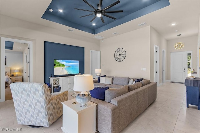 137 SE 23rd Ter, Cape Coral, FL 33990 - living room with visible vents, recessed lighting, ceiling fan, and a tray ceiling