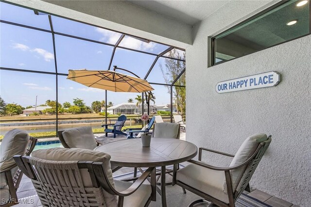 137 SE 23rd Ter, Cape Coral, FL 33990 - exterior space with outdoor dining area and a water view