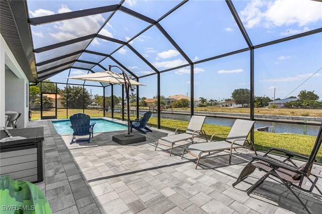 137 SE 23rd Ter, Cape Coral, FL 33990 - view of patio with a lanai, an outdoor pool, and a water view