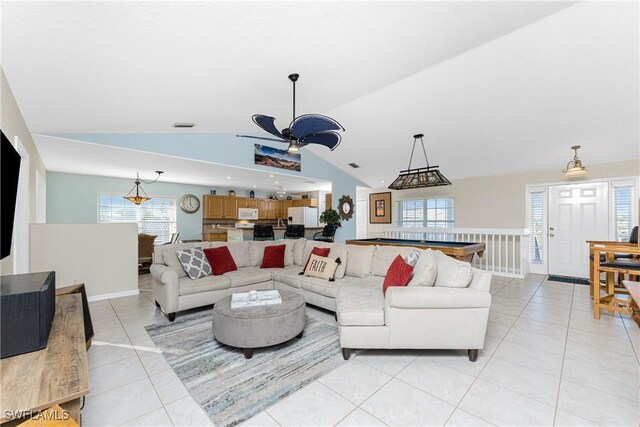 24343 Pirate Harbor Blvd, Punta Gorda, FL 33955 - living area featuring vaulted ceiling, a wealth of natural light, a ceiling fan, and light tile patterned floors