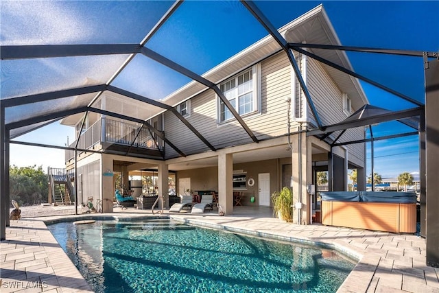 24343 Pirate Harbor Blvd, Punta Gorda, FL 33955 - exterior space with glass enclosure, a hot tub, a patio area, and stairs