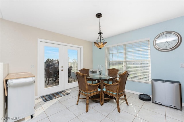 24343 Pirate Harbor Blvd, Punta Gorda, FL 33955 - dining room with french doors, baseboards, and light tile patterned floors