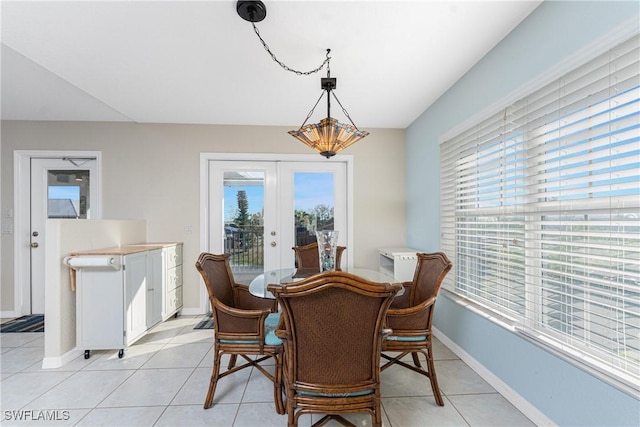 24343 Pirate Harbor Blvd, Punta Gorda, FL 33955 - dining space with baseboards, french doors, and light tile patterned floors