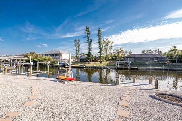 24343 Pirate Harbor Blvd, Punta Gorda, FL 33955 - view of dock featuring a residential view, a water view, and boat lift
