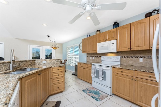 24343 Pirate Harbor Blvd, Punta Gorda, FL 33955 - kitchen featuring decorative backsplash, a ceiling fan, a sink, and white appliances
