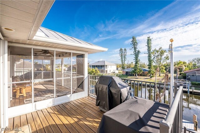 24343 Pirate Harbor Blvd, Punta Gorda, FL 33955 - deck featuring grilling area, a sunroom, a residential view, and a water view