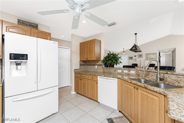 24343 Pirate Harbor Blvd, Punta Gorda, FL 33955 - kitchen with light stone counters, visible vents, light tile patterned floors, a sink, and white appliances