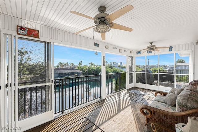 24343 Pirate Harbor Blvd, Punta Gorda, FL 33955 - sunroom with a ceiling fan and a water view
