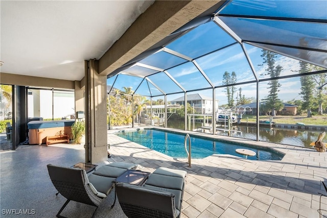 24343 Pirate Harbor Blvd, Punta Gorda, FL 33955 - pool with a lanai, a hot tub, a patio, and a water view