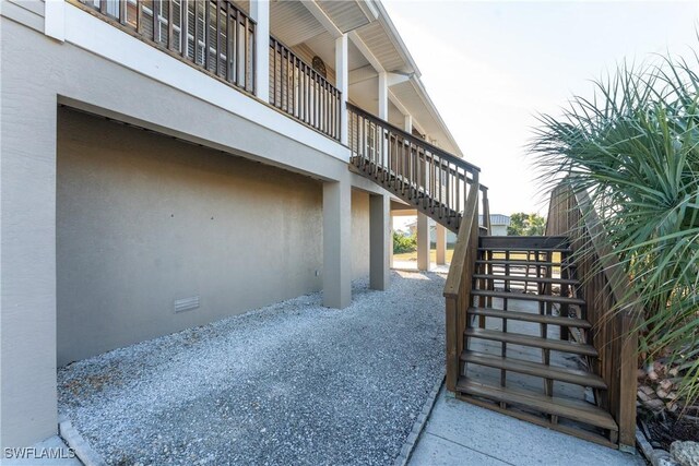 24343 Pirate Harbor Blvd, Punta Gorda, FL 33955 - exterior space featuring stairway and stucco siding