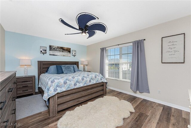 24343 Pirate Harbor Blvd, Punta Gorda, FL 33955 - bedroom featuring wood finished floors, a ceiling fan, and baseboards