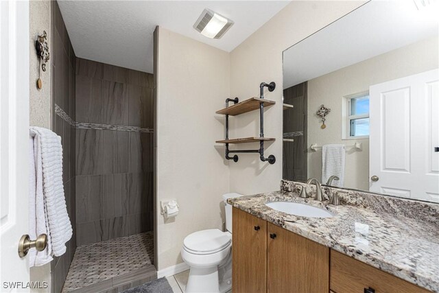 24343 Pirate Harbor Blvd, Punta Gorda, FL 33955 - bathroom with tile patterned floors, vanity, walk in shower, toilet, and visible vents