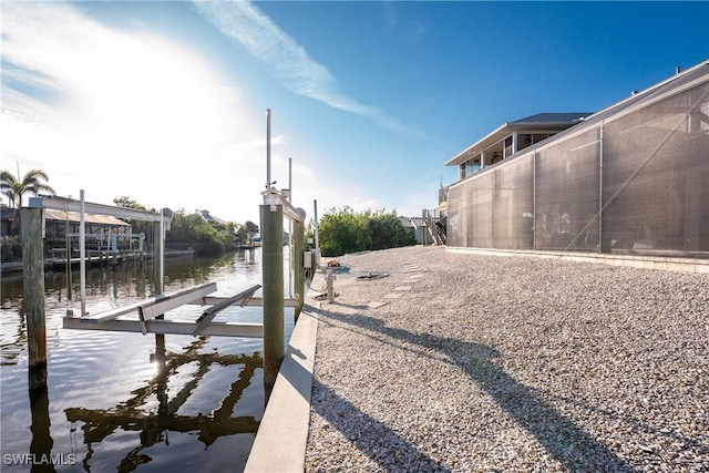 24343 Pirate Harbor Blvd, Punta Gorda, FL 33955 - view of road with boat lift and a water view