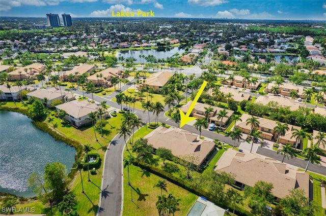 aerial view featuring a water view and a residential view