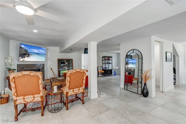 sitting room with ceiling fan, a fireplace, recessed lighting, baseboards, and visible vents