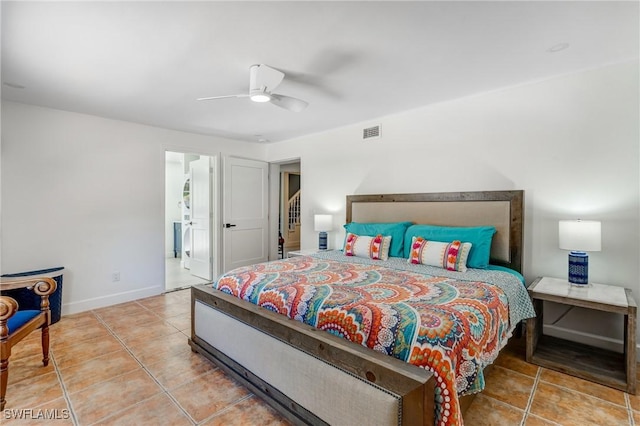 bedroom with a ceiling fan, tile patterned floors, visible vents, and baseboards