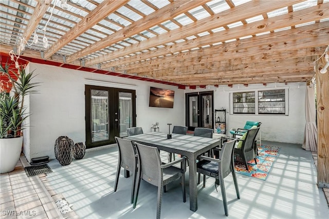 view of patio with french doors, a pergola, and outdoor dining area