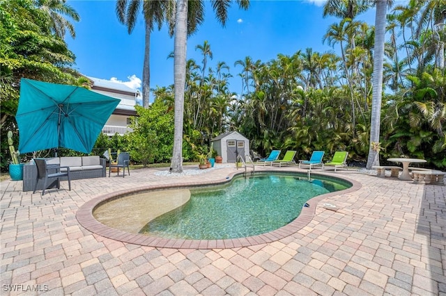 outdoor pool featuring an outdoor living space, a storage unit, a patio, and an outbuilding