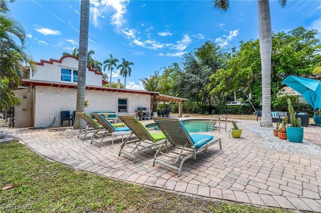 view of patio featuring an outdoor pool
