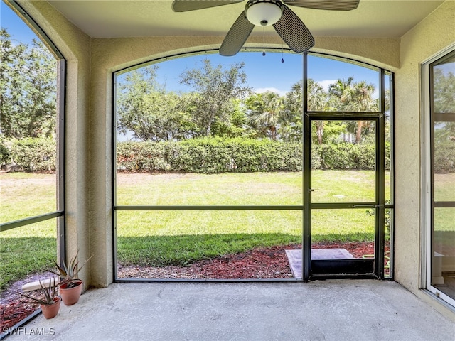 20298 Larino Loop, Estero, FL 33928 - unfurnished sunroom featuring a ceiling fan