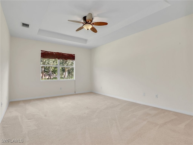 20298 Larino Loop, Estero, FL 33928 - unfurnished room featuring a raised ceiling, ceiling fan, light carpet, and baseboards
