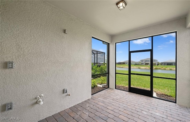 42729 Valley Brooks St, Punta Gorda, FL 33982 - unfurnished sunroom featuring a water view