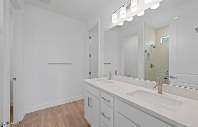 42729 Valley Brooks St, Punta Gorda, FL 33982 - bathroom with tiled shower, double vanity, and wood finished floors