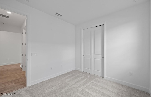42729 Valley Brooks St, Punta Gorda, FL 33982 - unfurnished bedroom featuring a closet and light carpet