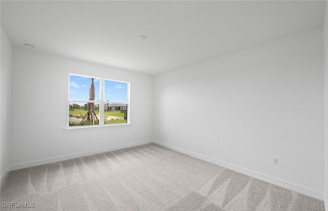 42729 Valley Brooks St, Punta Gorda, FL 33982 - carpeted spare room featuring baseboards
