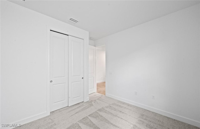 42729 Valley Brooks St, Punta Gorda, FL 33982 - unfurnished bedroom featuring carpet flooring and a closet