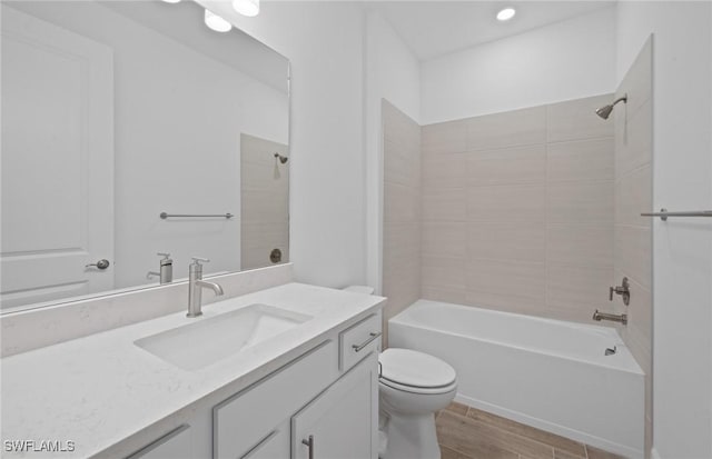 42729 Valley Brooks St, Punta Gorda, FL 33982 - bathroom with vanity,  shower combination, wood finished floors, and recessed lighting