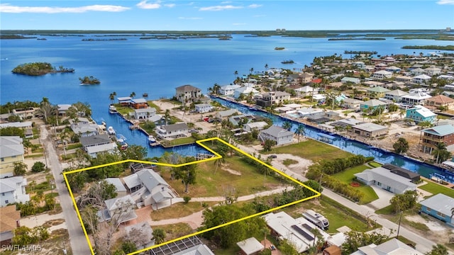 175 Bahia Via, Fort Myers Beach, FL 33931 - aerial perspective of suburban area with a large body of water and property parcel outlined