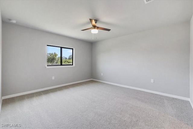 2609 59th St W, Lehigh Acres, FL 33971 - empty room with a ceiling fan, baseboards, and carpet floors