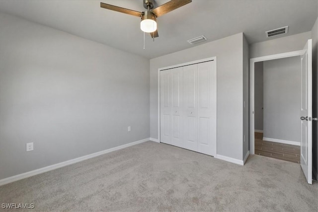 2609 59th St W, Lehigh Acres, FL 33971 - unfurnished bedroom featuring carpet, visible vents, and baseboards