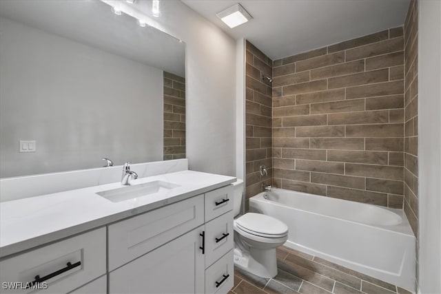 2609 59th St W, Lehigh Acres, FL 33971 - bathroom featuring toilet, shower / bathtub combination, vanity, and wood finished floors