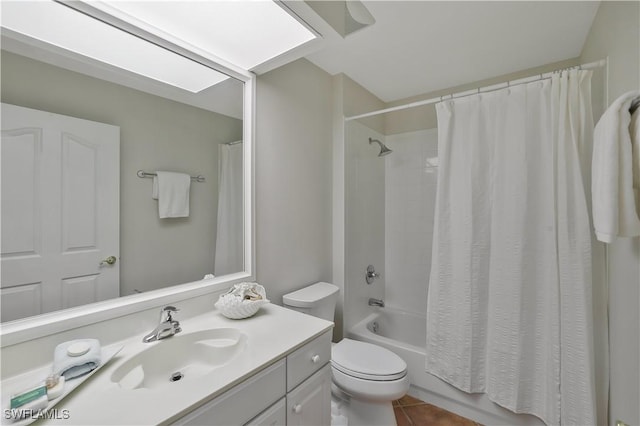 bathroom with tile patterned floors, shower / bath combination with curtain, vanity, and toilet