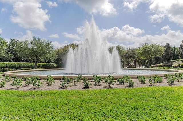 1036 Egrets Walk Cir Unit 202, Naples, FL 34108 - view of community featuring a yard