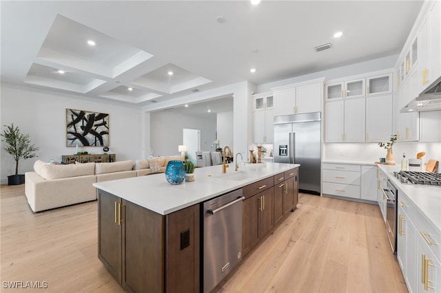 16214 Verilyn Cir, Naples, FL 34110 - kitchen featuring light wood-type flooring, a kitchen island with sink, appliances with stainless steel finishes, and a sink