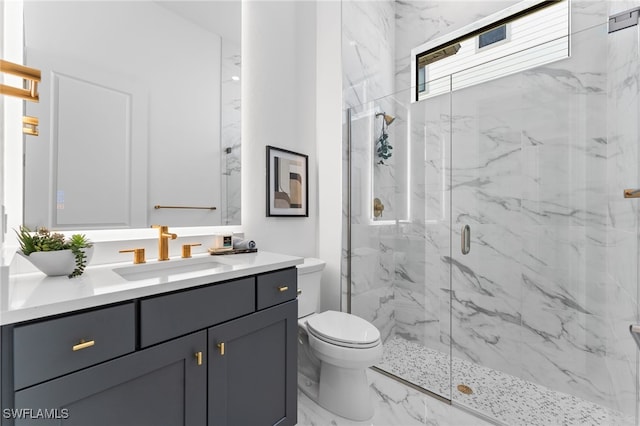 16214 Verilyn Cir, Naples, FL 34110 - full bathroom featuring marble finish floor, vanity, a marble finish shower, and toilet