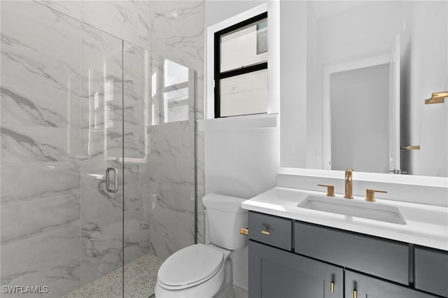 16214 Verilyn Cir, Naples, FL 34110 - bathroom with toilet, vanity, and a marble finish shower