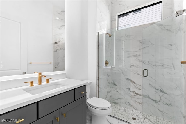 16214 Verilyn Cir, Naples, FL 34110 - full bath featuring marble finish floor, toilet, vanity, and a marble finish shower