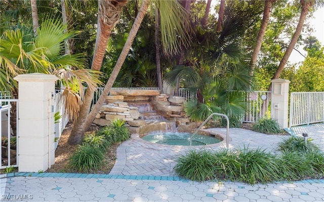view of yard featuring fence and a gate