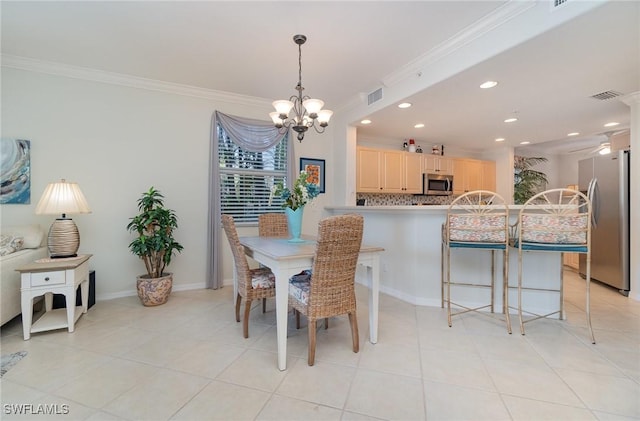 dining room with crown molding, visible vents, recessed lighting, and a notable chandelier