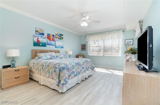 bedroom featuring baseboards, ornamental molding, light wood finished floors, and ceiling fan
