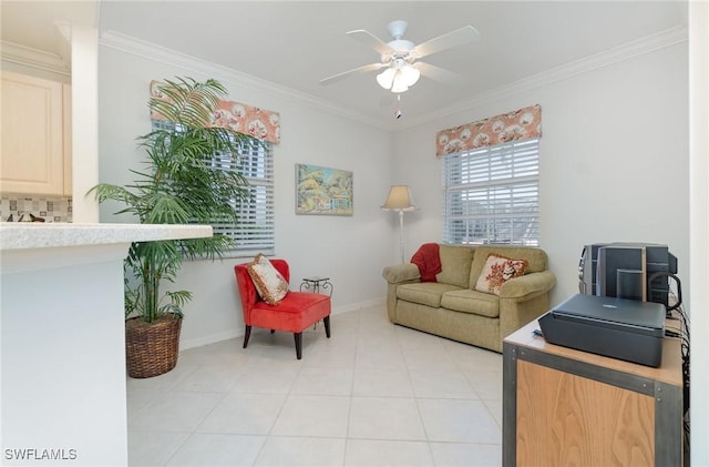 interior space featuring crown molding, baseboards, ceiling fan, and light tile patterned floors